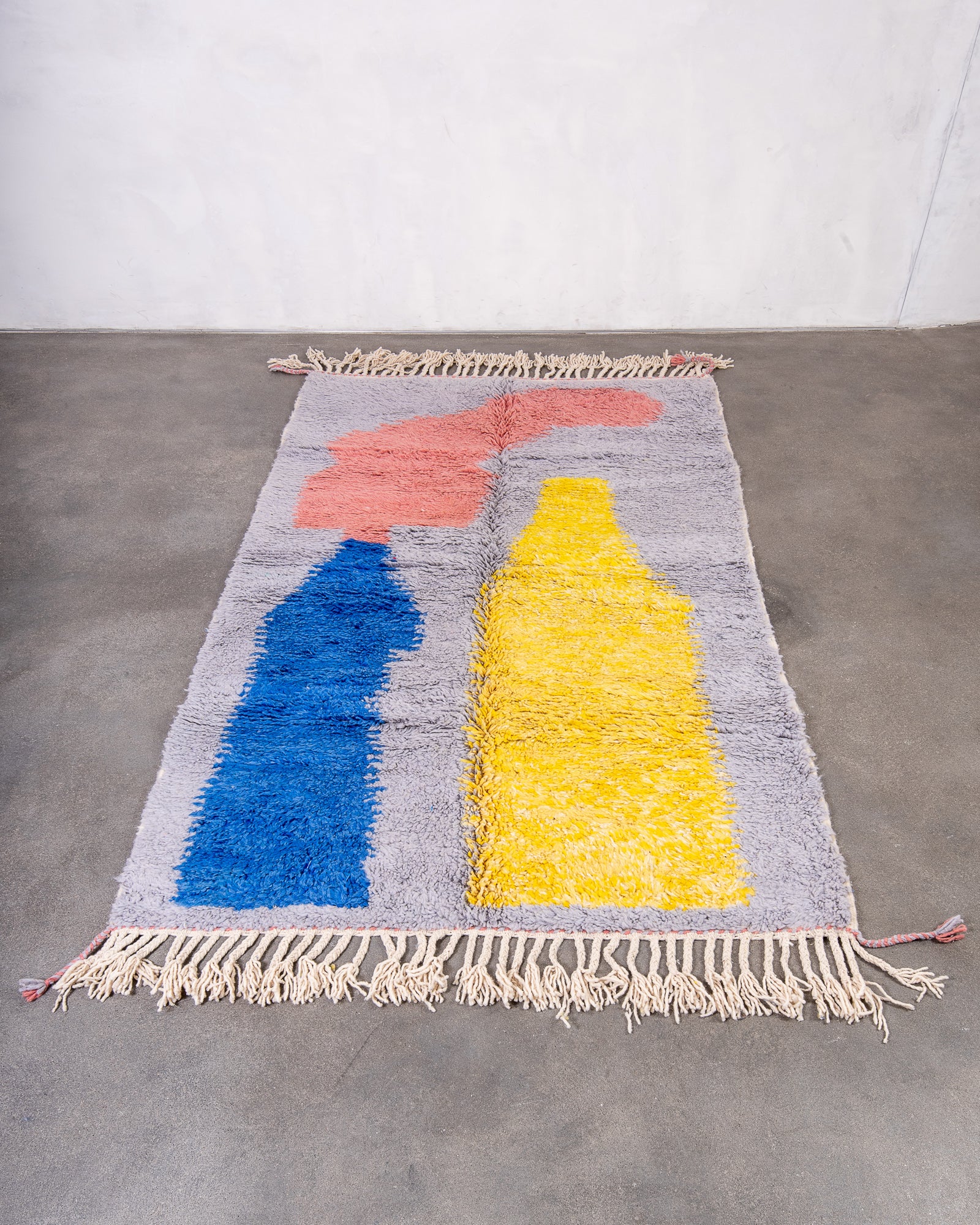 Modern, designer, handcrafted Berber rug from Morocco. Beniourain carpet with beautiful colours and patterns and fluffy wool texture.